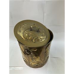 Arts and Craft brass coal box of cylindrical, with embossed stylised leaf panels, with twin handles, the cover with triform handle, H42cm 