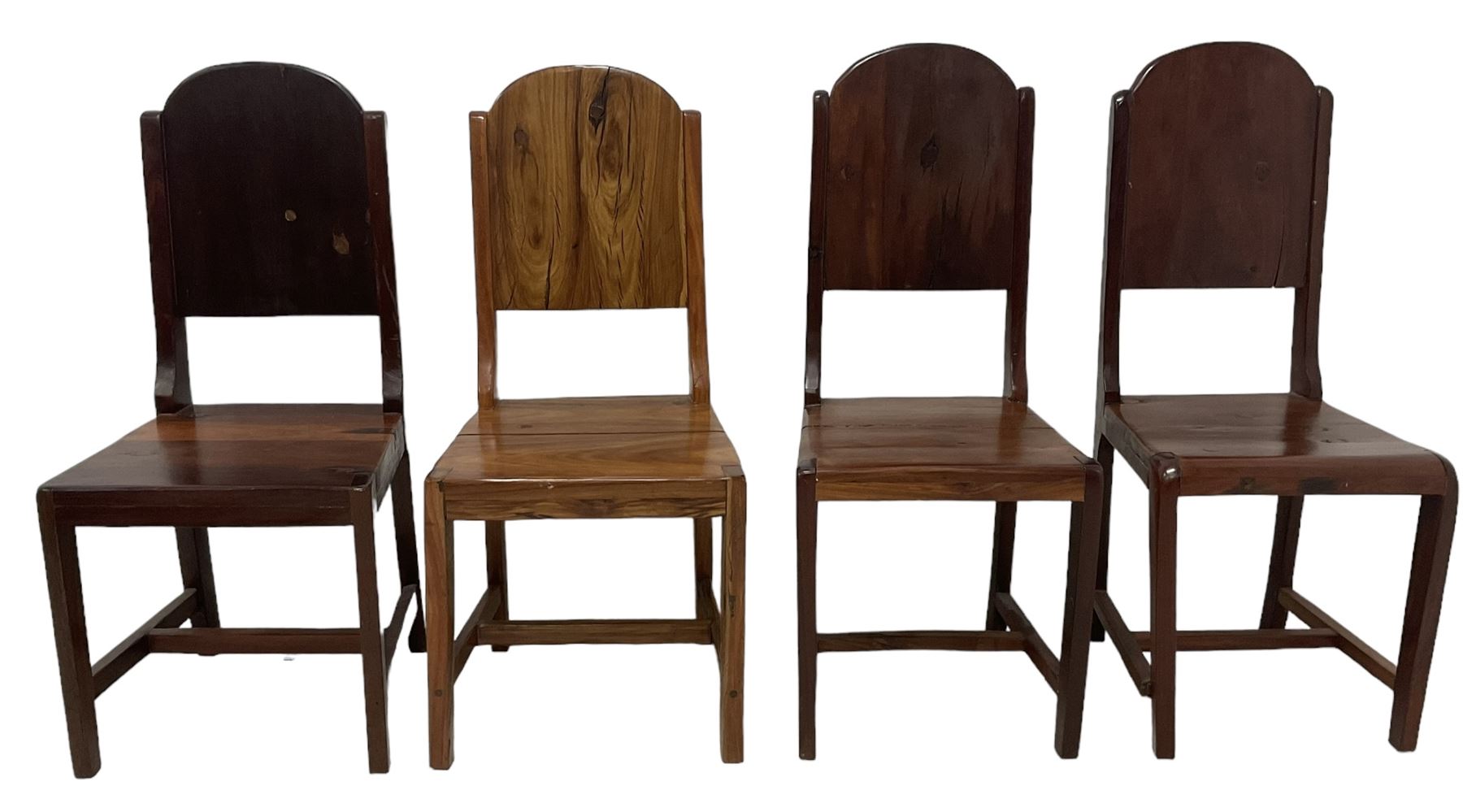 Mid-to-late 20th century teak dining table, rectangular top with canted corners, on square tapering supports with spade feet (214cm x 119cm, H76cm); and a set of eight Burmese reclaimed teak dining chairs, high arched back over panelled seat