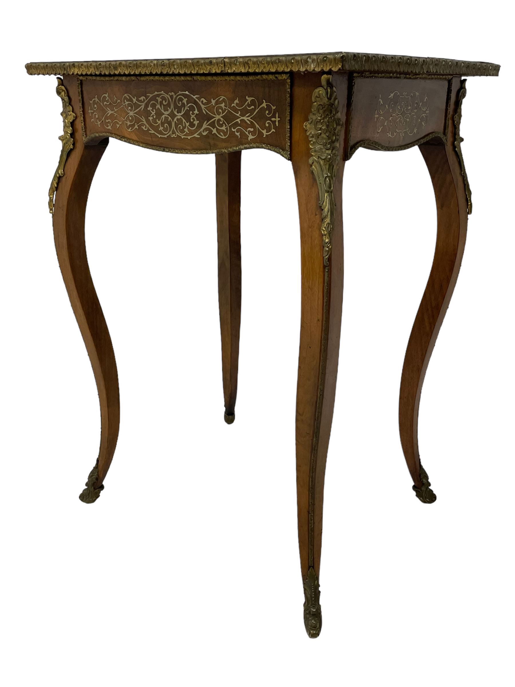 In the manner of Émile Gallé - late 19th to early 20th century inlaid walnut side table, rectangular top inlaid with Japonisme decoration depicting birds within trees, figured crossbanding and cast gilt foliate applied edge, single frieze drawer inlaid with scrolling brass work, on cabriole supports with ornate floral mounts