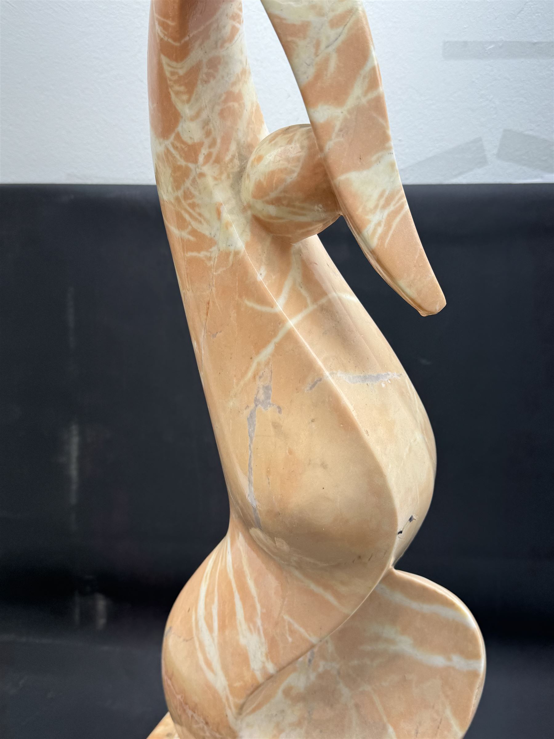 Abstract pink marble sculpture, upon a rectangular base, H63cm