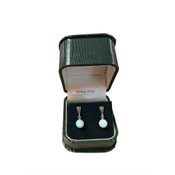 Pair of silver marcasite and opal pendant stud earrings, stamped, boxed 