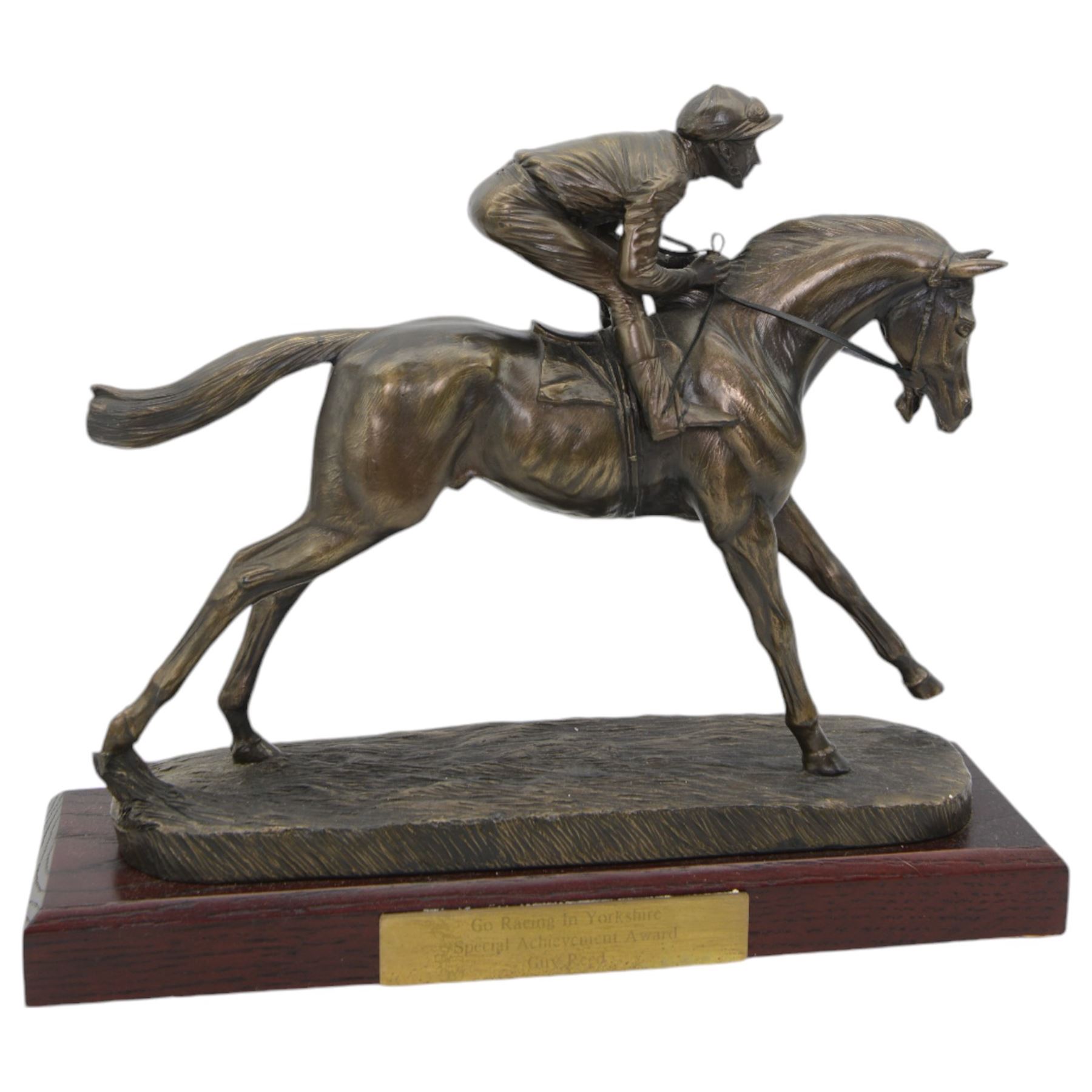 'Go Racing in Yorkshire Special Achievement Award, Guy Reed' - Bronze resin figure of a racehorse with jockey up on wooden plinth 30cm x 35cm and another 'Winning Owner Cadbury Cup July 2008 York Racecourse' on wooden base 30cm x 33cm (2)