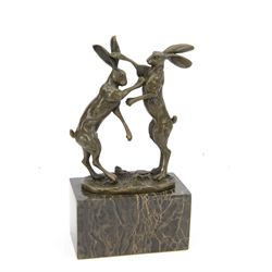 Bronze figure group, modelled as two male hares boxing, raised upon marble plinth base, wi...