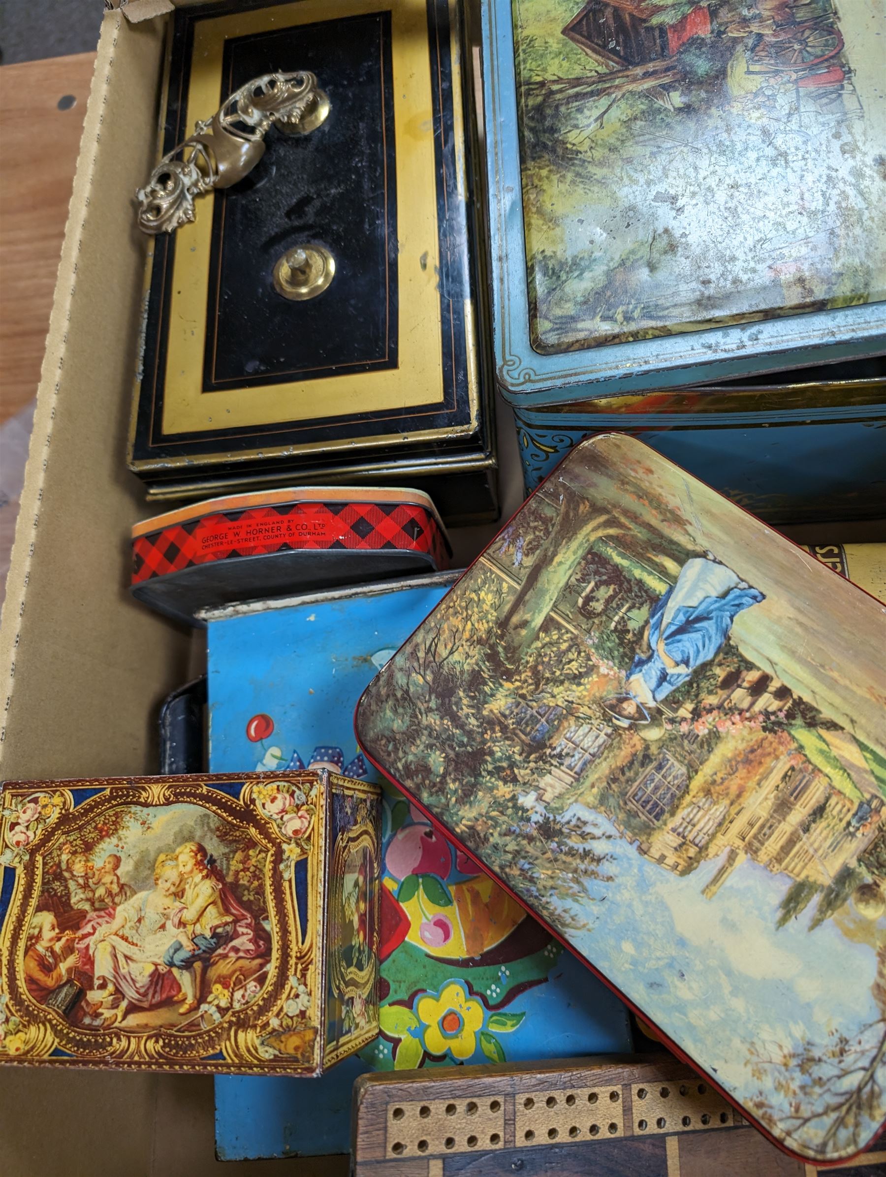 Collection of vintage tins and boxes, including advertising examples