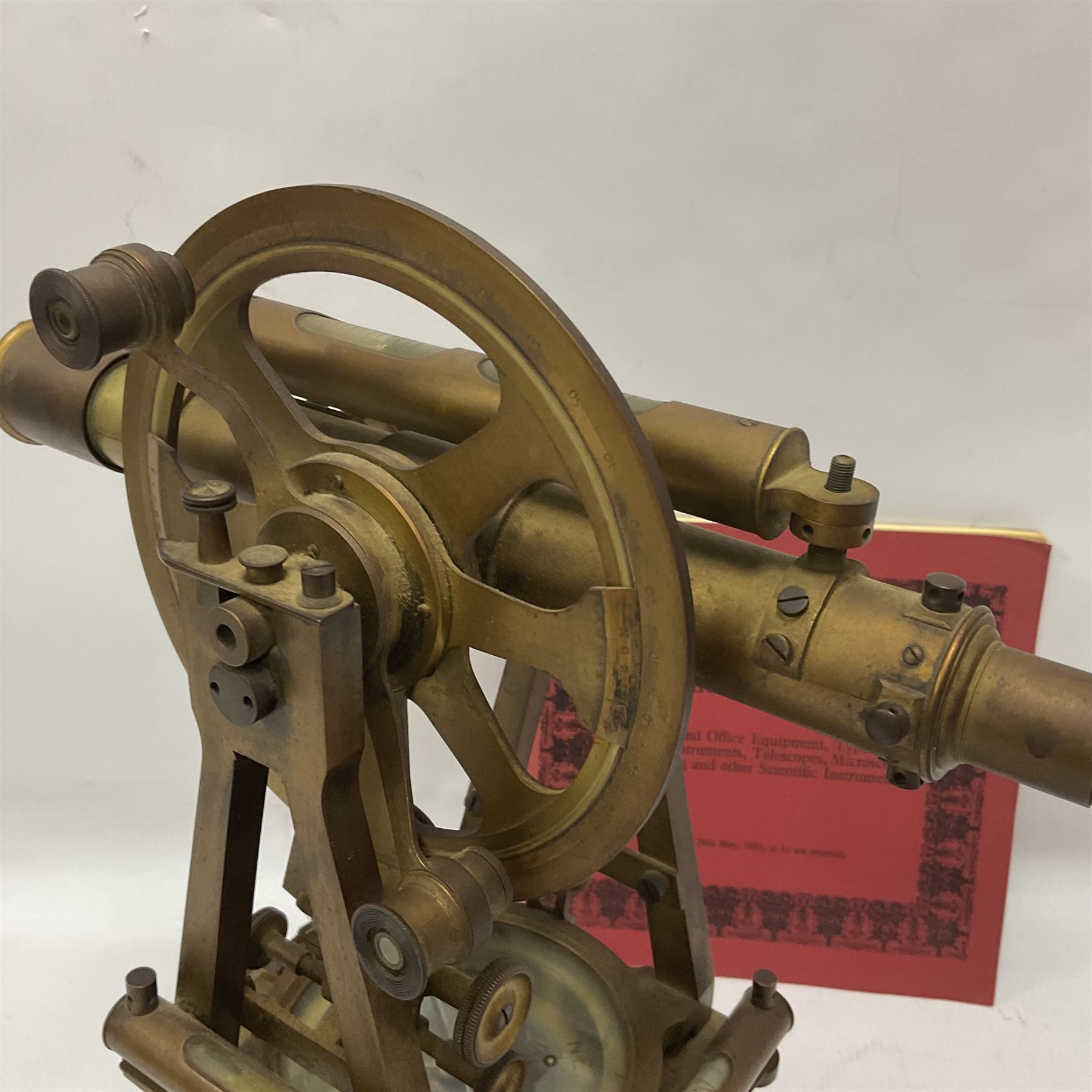 19th century brass transit theodolite by Troughton & Simms, the sighting telescope with rack and pinion focusing, above an inset compass, upon four levelling feet and a rectangular wooden base, including base H35.5cm