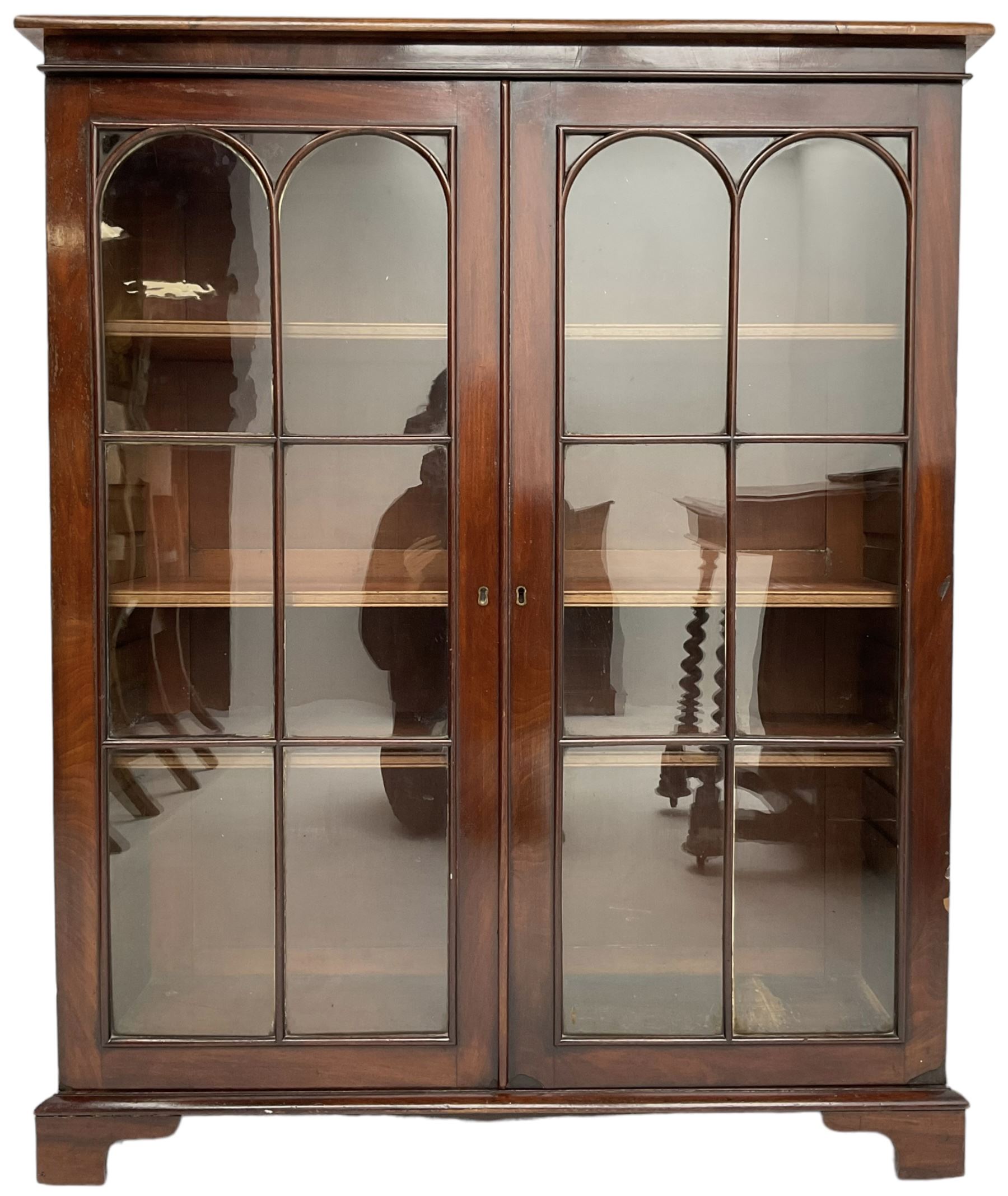 Early 20th century mahogany bookcase, fitted with two astragal glazed doors enclosing three adjustable shelves