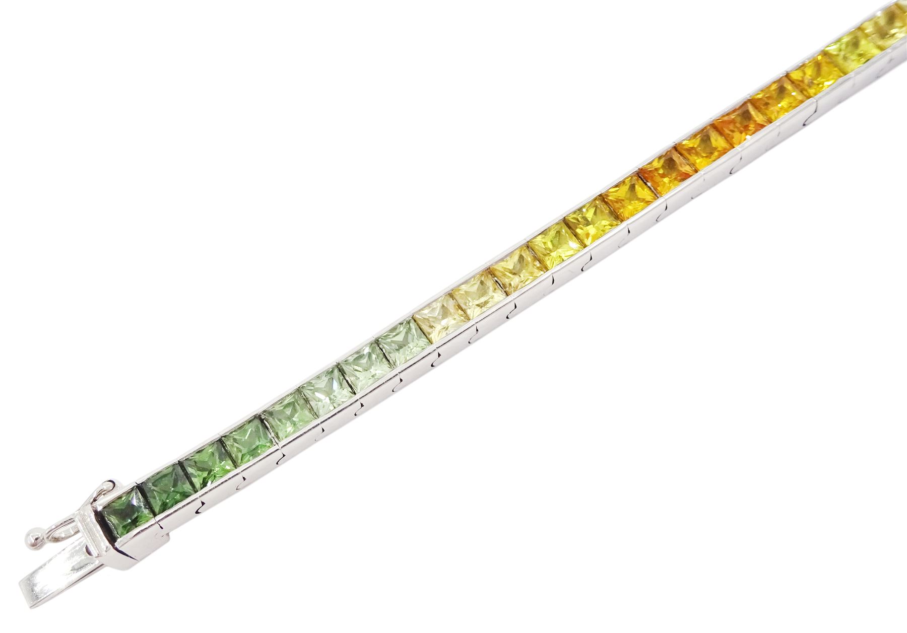 18ct white gold channel set multicoloured sapphire bracelet, sixty-one princess cut sapphires, various hues including blue, pink, green, yellow and teal, London 2004