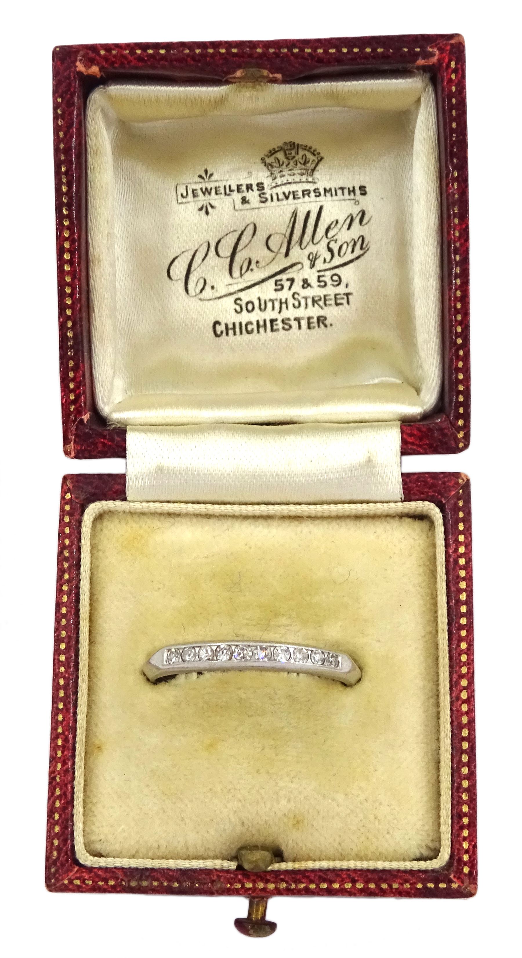 Early 20th century platinum channel set old cut diamond half eternity ring, stamped Plat, boxed