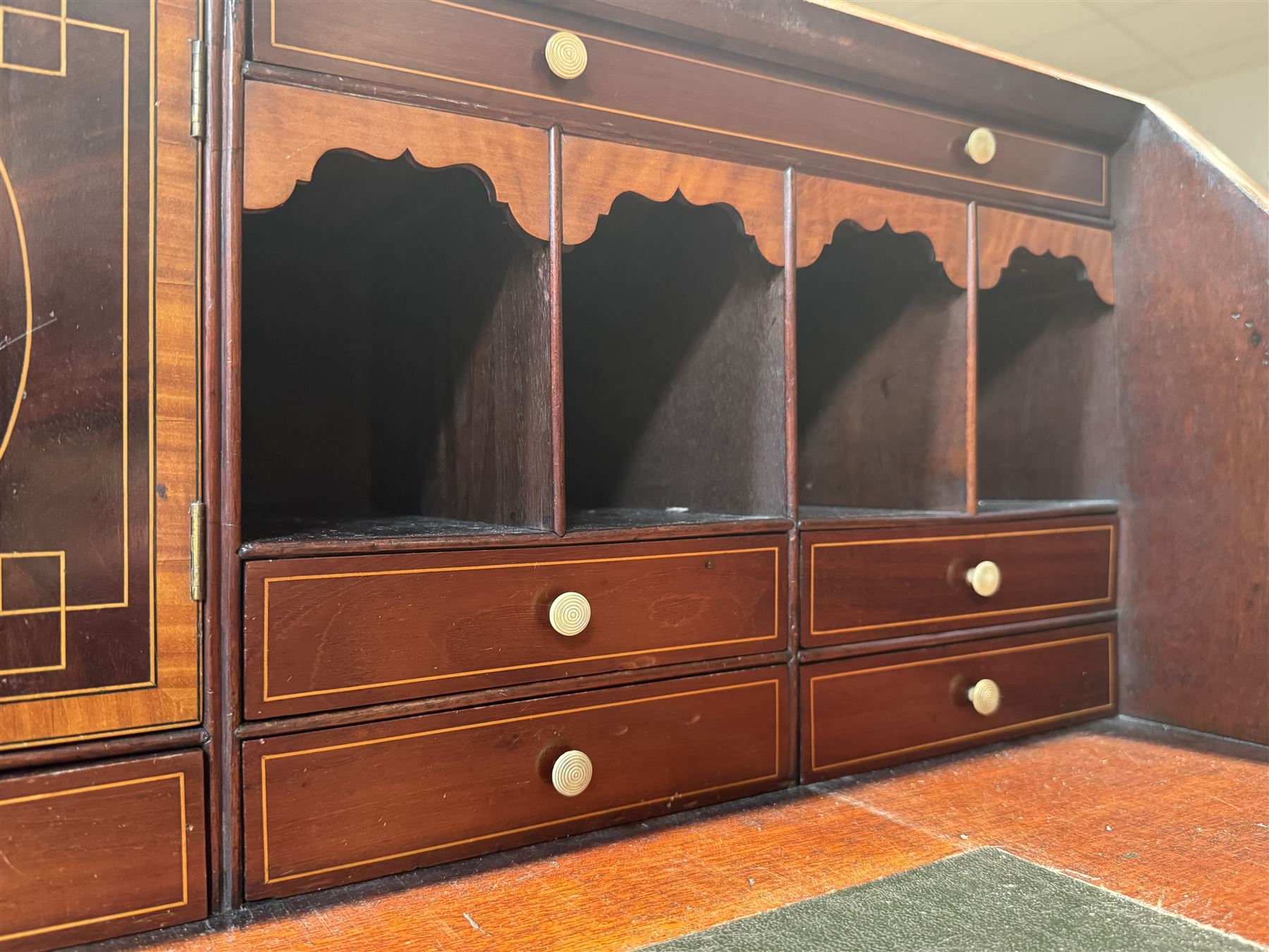 Georgian mahogany bureau, moulded fall front enclosing cupboard, small drawers, pigeonholes and inset writing surface, fitted with four long graduating cock-beaded drawers, on splayed bracket feet 