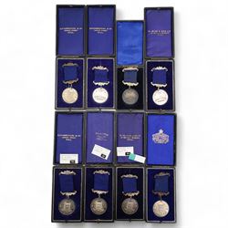 Eight Hull Education Committee 'Perfect Attendance At School' hallmarked silver medallions, each housed in a fitted case