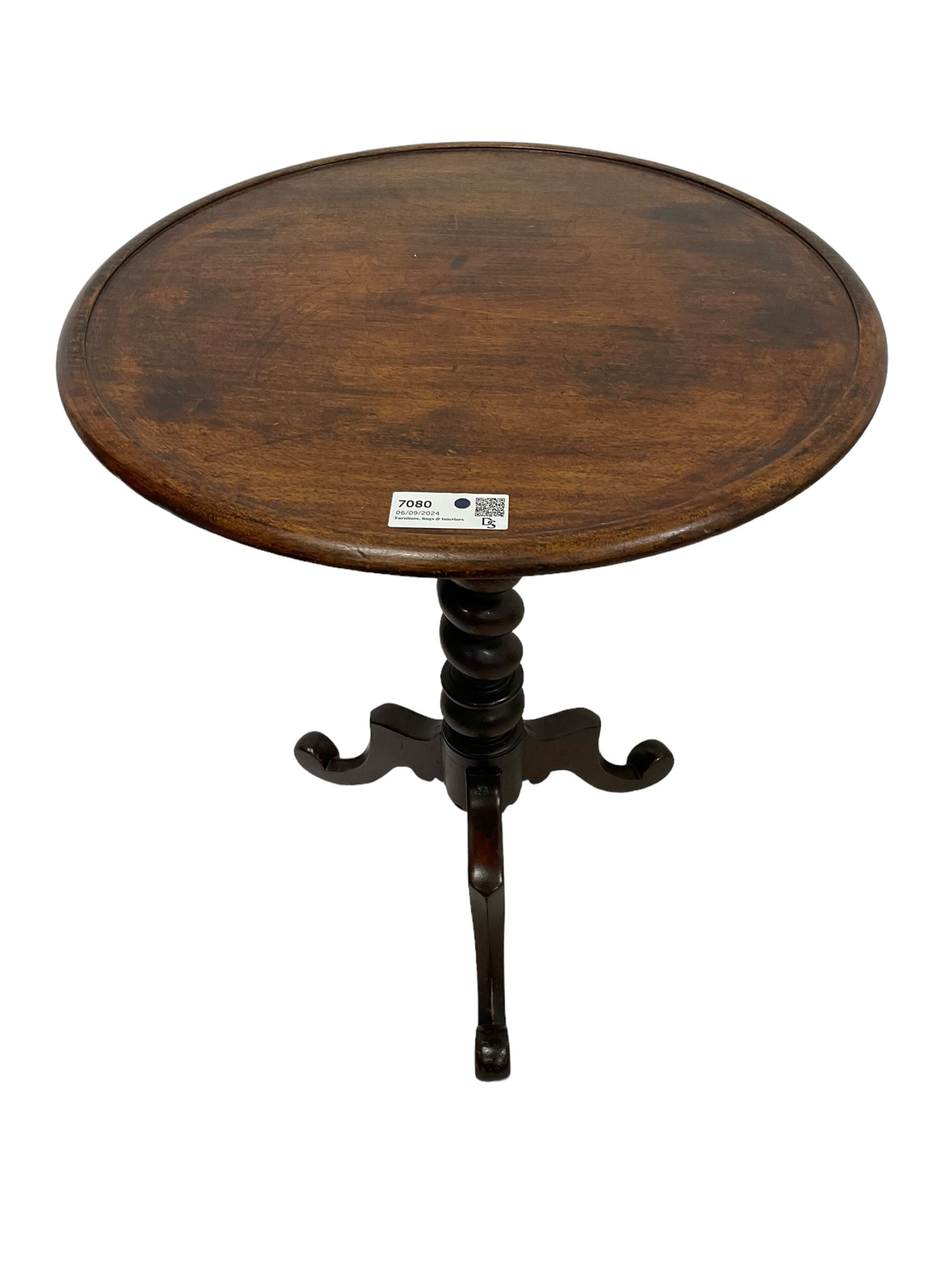 Victorian mahogany tripod table, dished circular top on spiral turned column, three splayed supports with scrolled terminals 