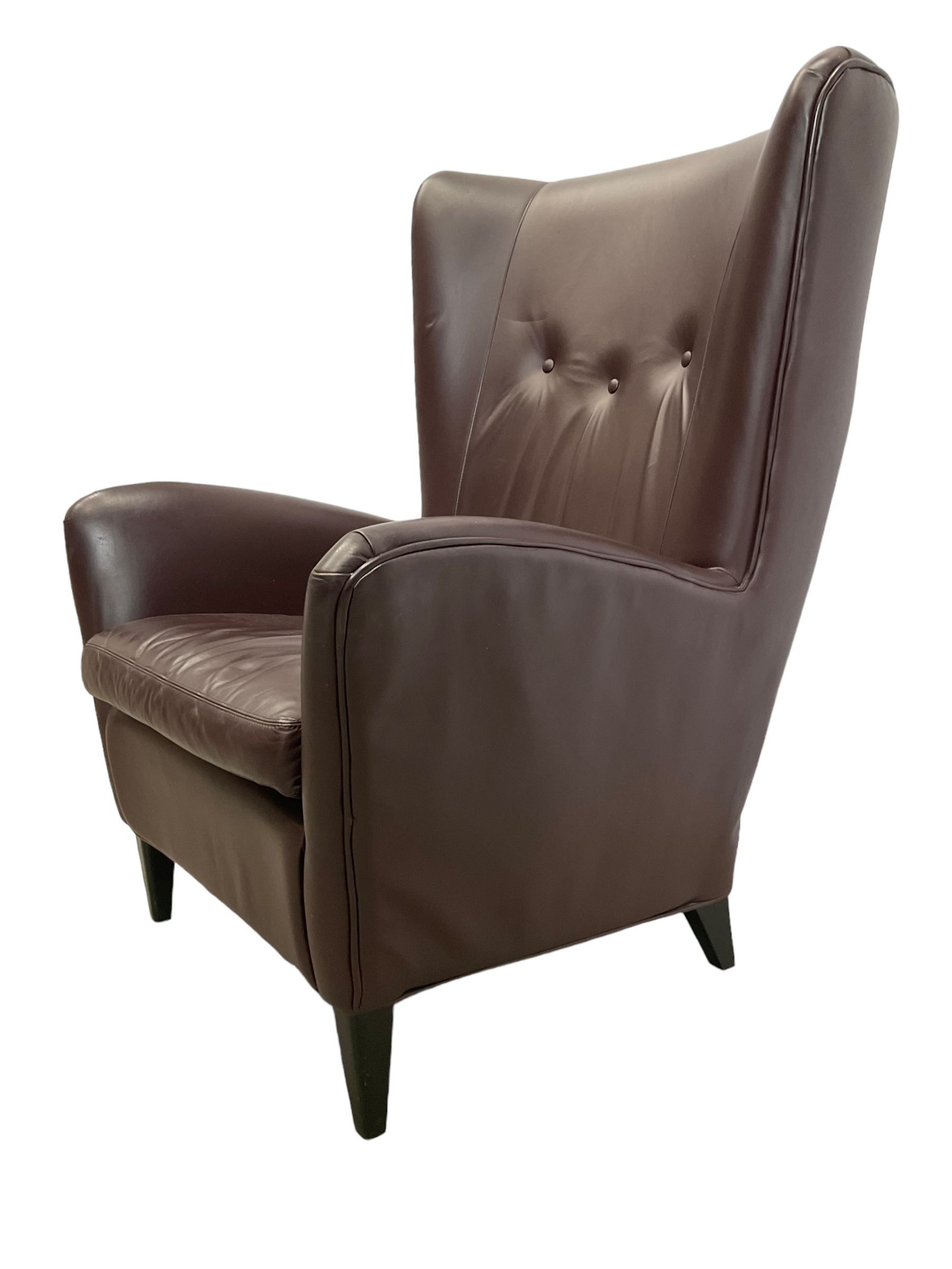 Wing back armchair upholstered in cocoa brown leather