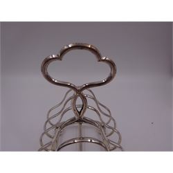 Victorian silver seven bar toast rack, each bar of trilobed form, with similar loop handle and upon four bun feet, hallmarked John Gilbert, Birmingham 1863, H16.5cm