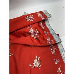 Early 20th century Chinese Han silk skirt, embroidered with flowers and butterflies, on a red ground, purchased from Liberty, London