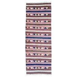 Kilim muted pink ground runner, decorated with rows of horizontal bands in muted tones, al...