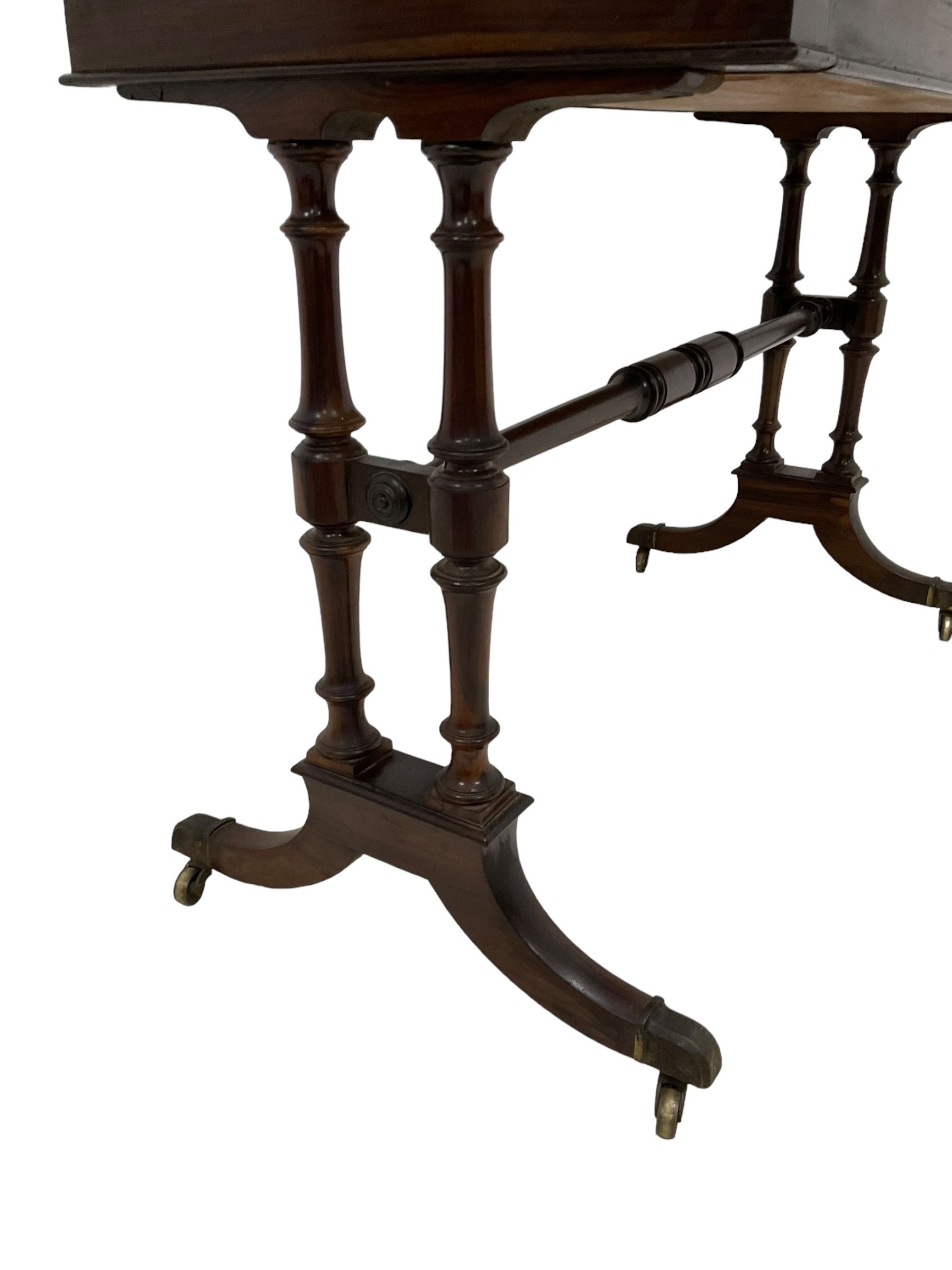 Regency rosewood card table, fold-over swivel action rectangular top with crossbanding, single frieze drawer, raised on turned end supports terminating in splayed feet with castors, joined by ring turned stretcher