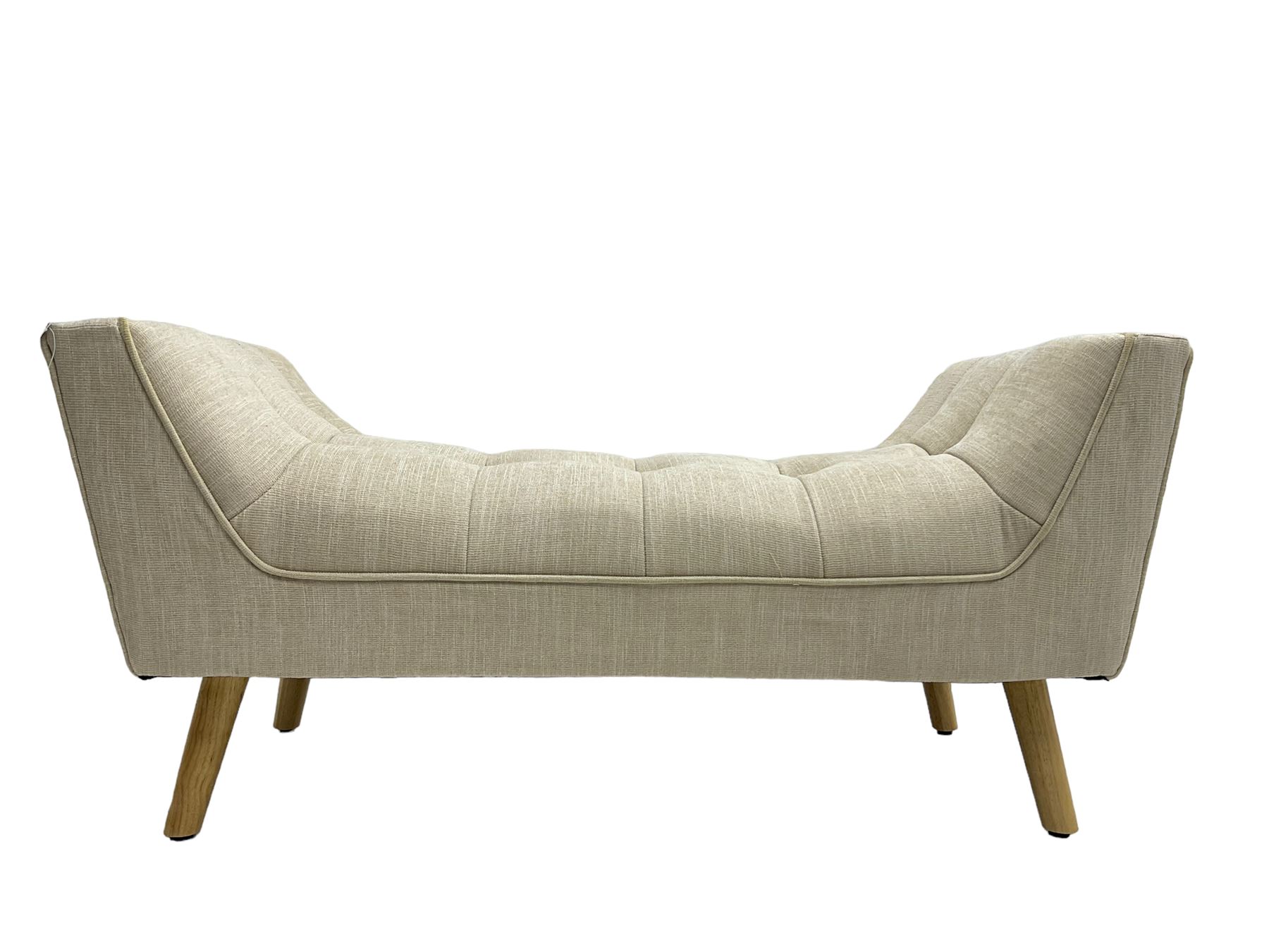 Contemporary U-shaped window or bed stool, upholstered in buttoned neutral fabric