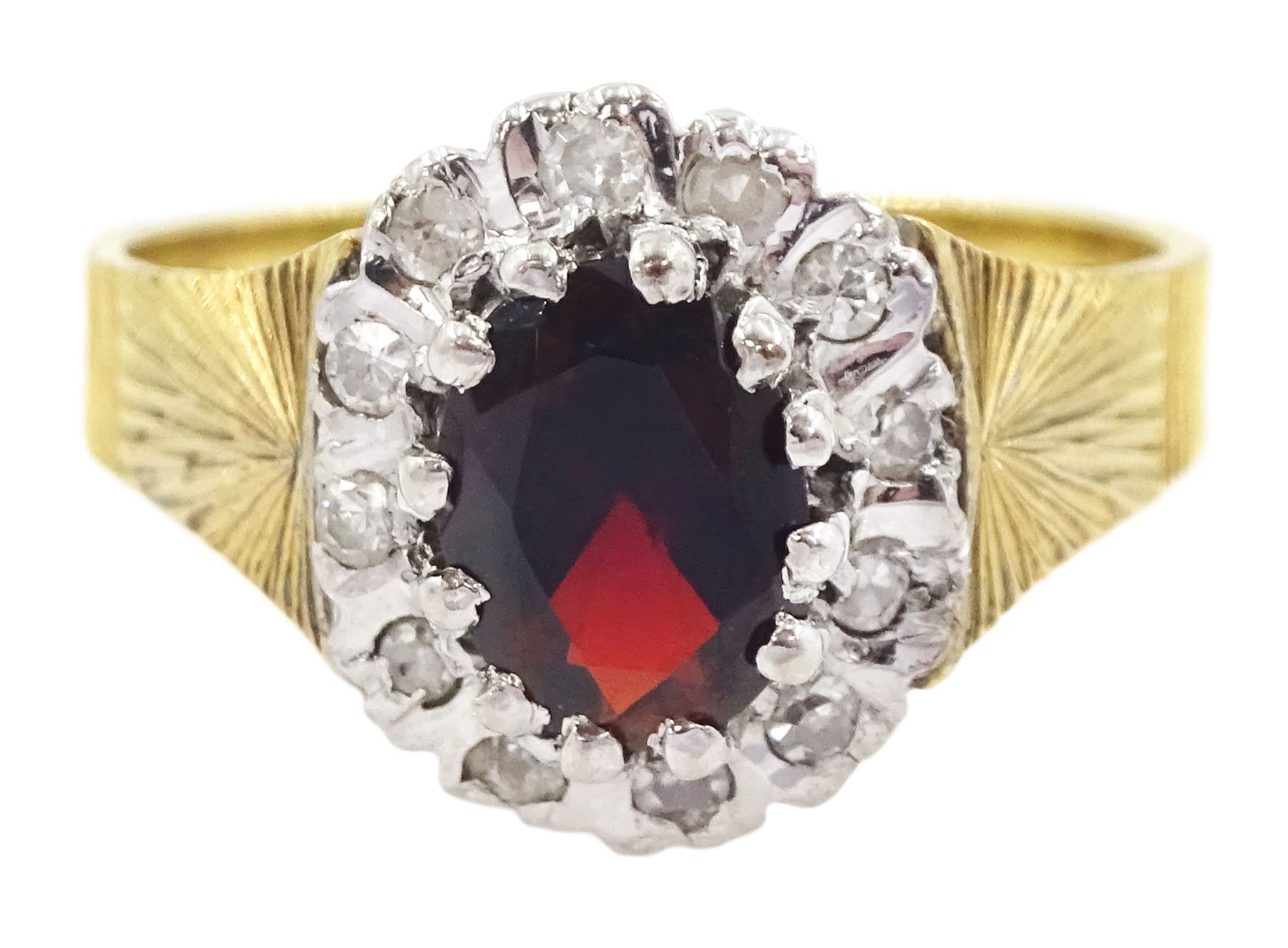 18ct gold oval cut garnet and diamond cluster ring, London 1975