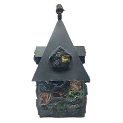 20th Century Arts & Crafts wrought iron porch lantern, in the manner of Peter Marsh, modelled as a house set with coloured resin panels, H38cm