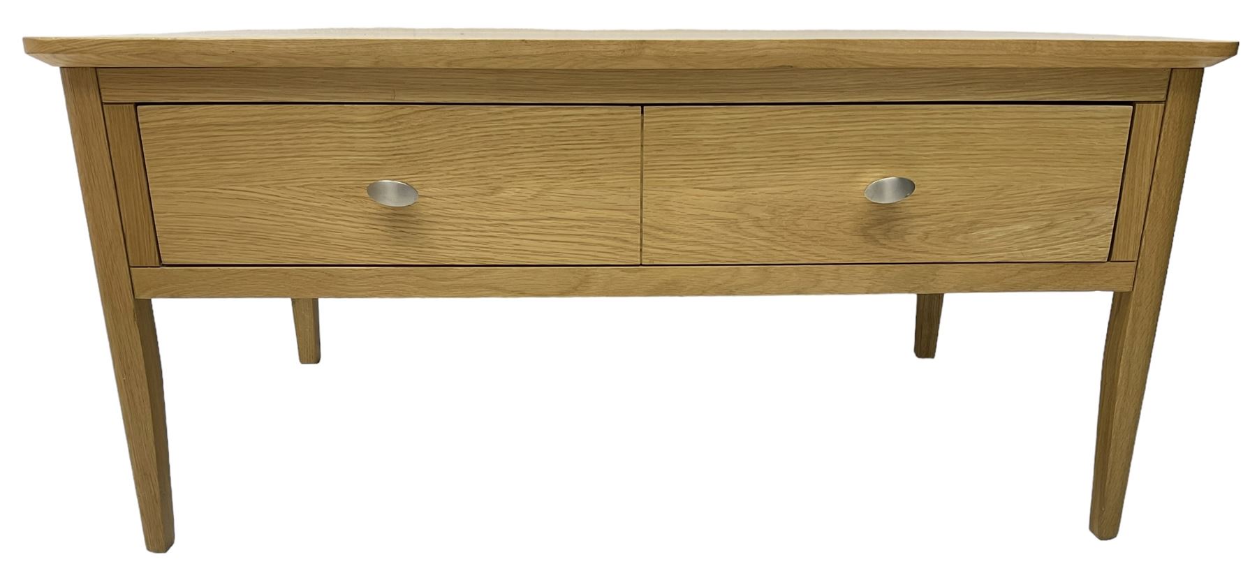 Contemporary light oak rectangular coffee table, fitted with single drawer disguised as two drawers to each side, on tapering supports