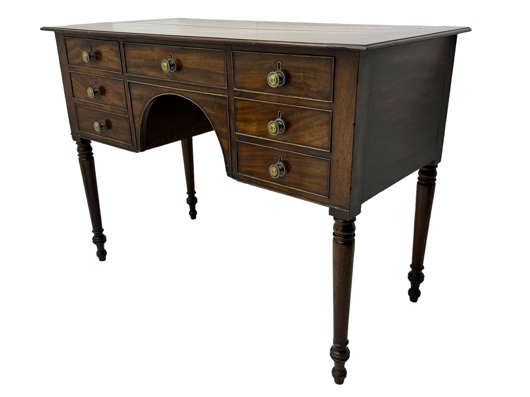 George III mahogany kneehole dressing or side table, moulded rectangular top over seven cock-beaded drawers, on ring turned support 