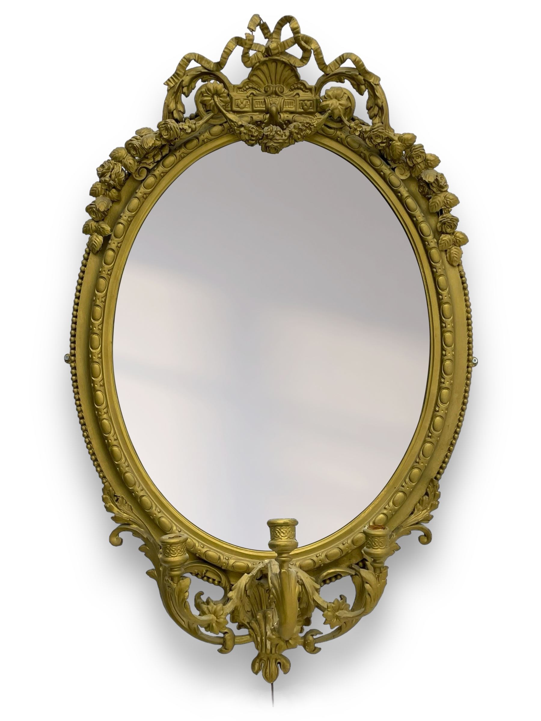 19th century giltwood and gesso girandole wall mirror, the raised pediment decorated with ribbon tie over curled acanthus leaves and flowerhead festoons, oval egg and dart moulded frame with outer bead, three projecting candle sconces in the form of scrolled acanthus leaves, lower shell motif with extending leaf decoration 