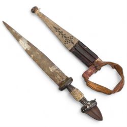 North African arm dagger with leather scabbard, blade length 19cm and a South American hunting knife, the ricasso marked 'Rio Branco', blade length 18cm (2) 