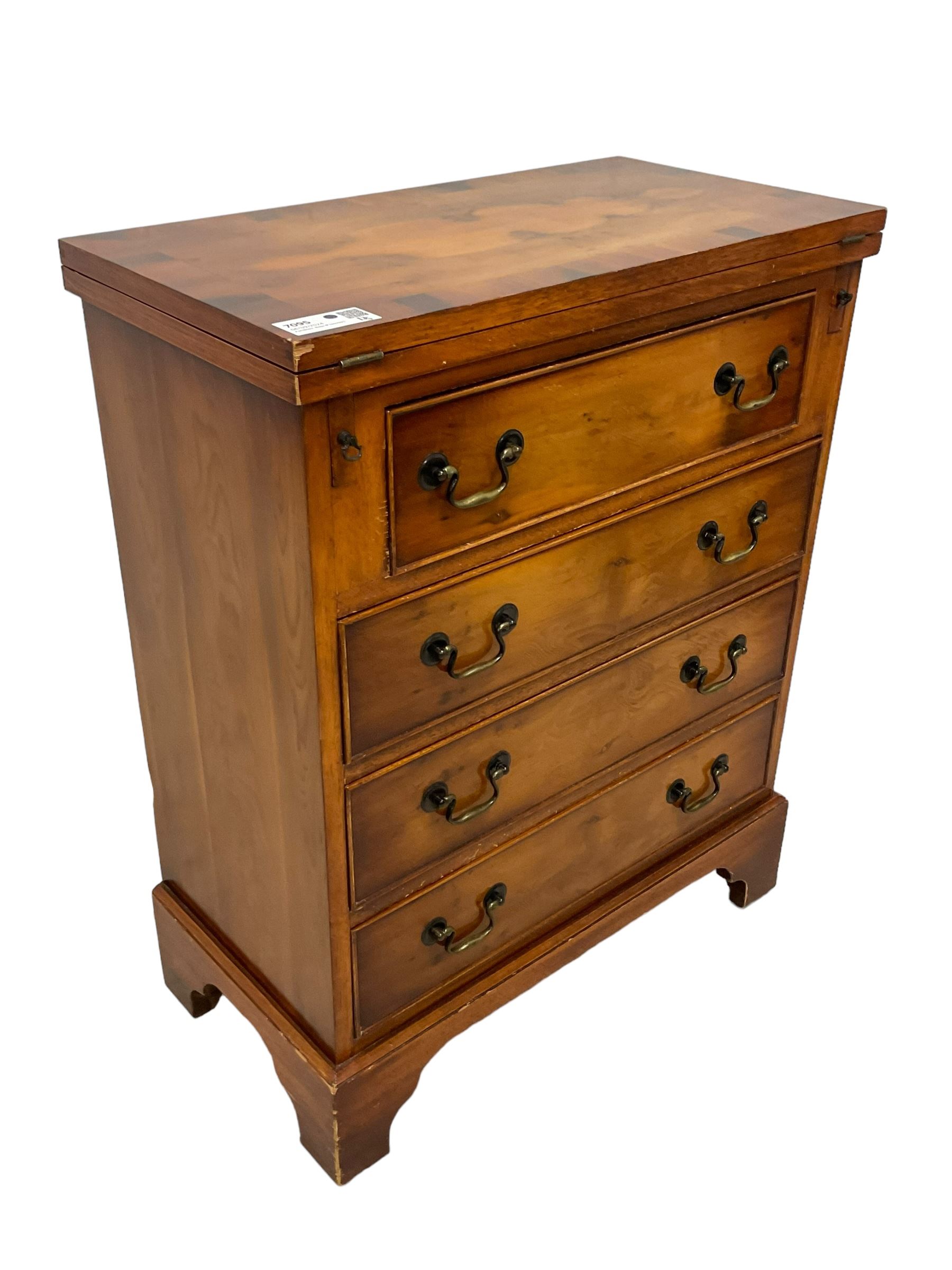 Georgian design yew wood bachelor's chest, fold-over rectangular top supported by pull-out stays, fitted with four long cock-beaded drawers, on bracket feet