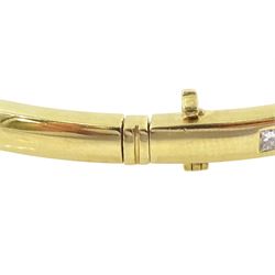 18ct gold diamond hinged bangle with forty-three channel set, princess cut diamonds, hallmarked