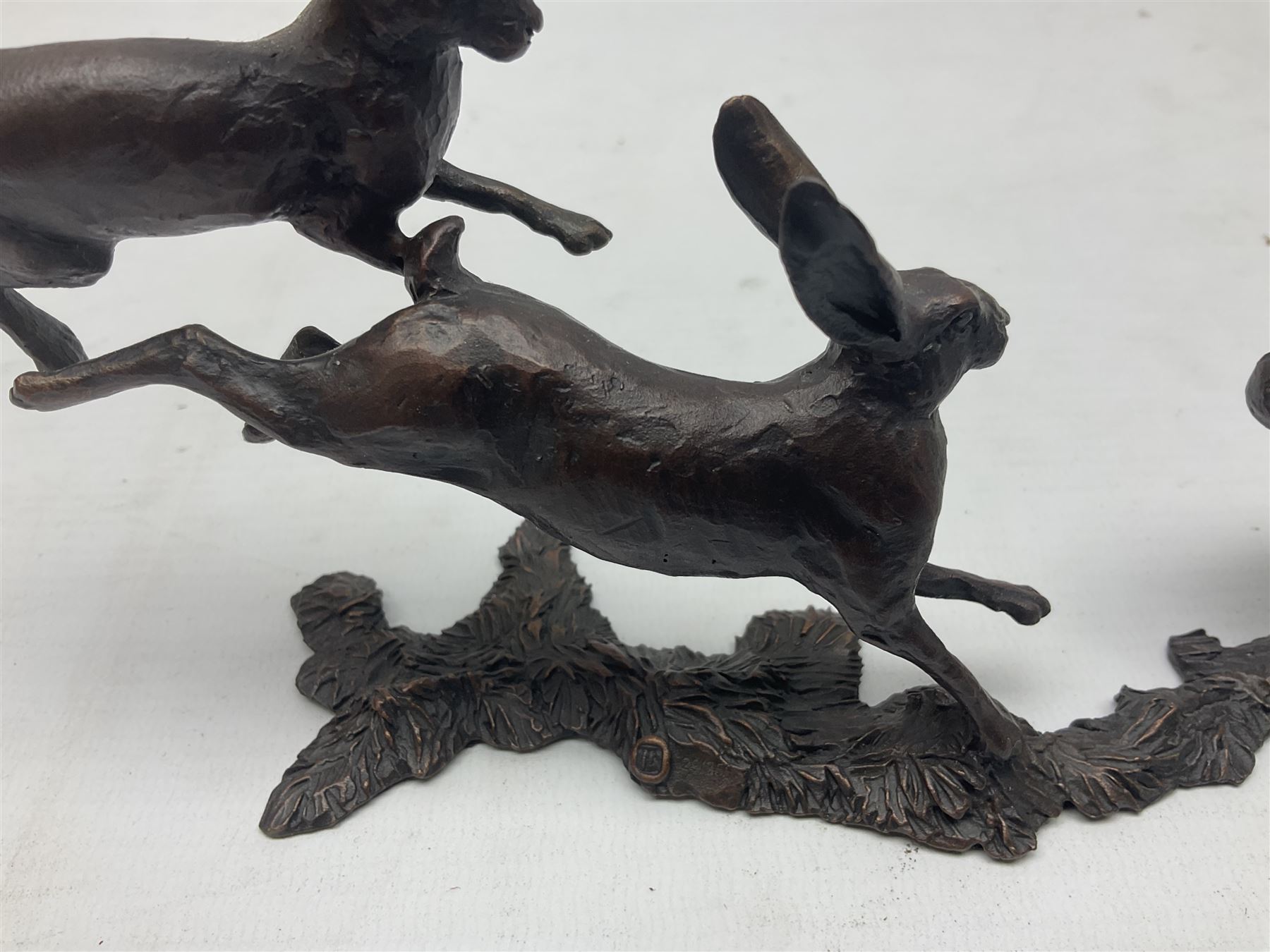 Michael Simpson: bronze Small Hares Running, modelled as three hares, limited edition 29/350, with certificate, H11cm 