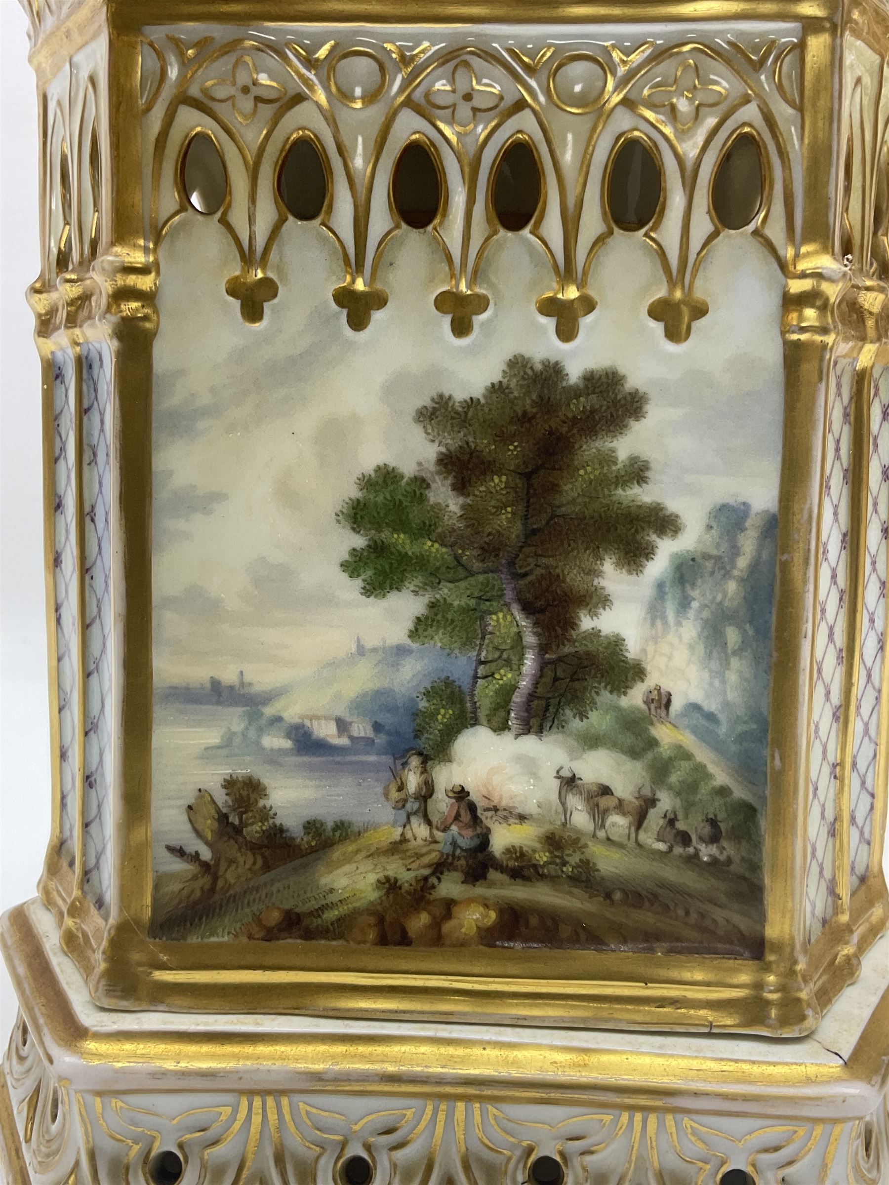 Two 19th century continental teapots and warmers, each teapot upon a hexagonal warming base, the first example painted with landscape scenes, the second with nesting birds in gilt branches, H28cm