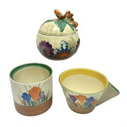 Clarice Cliff for Newport Pottery ceramics, comprising preserve jar and Bon Jour shape teacup, both in Crocus pattern, together with a Clarice Cliff for Wilkinson Ltd, preserve jar with cover, in Gayday pattern, preserve jar H10cm