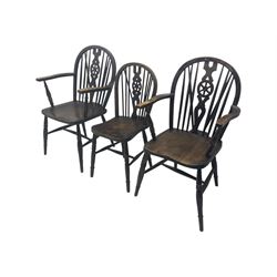 Set of six 19th century elm and ash dining chairs, hoop back with pierced wheel-shaped central splat, shaped saddle seat, raised on turned supports united by H-stretchers