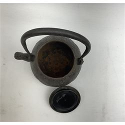 Chinese cast iron teapot, of bulbous form with ring handle, zoomorphic spout and low relief stylised decoration to body, not including handle H14cm