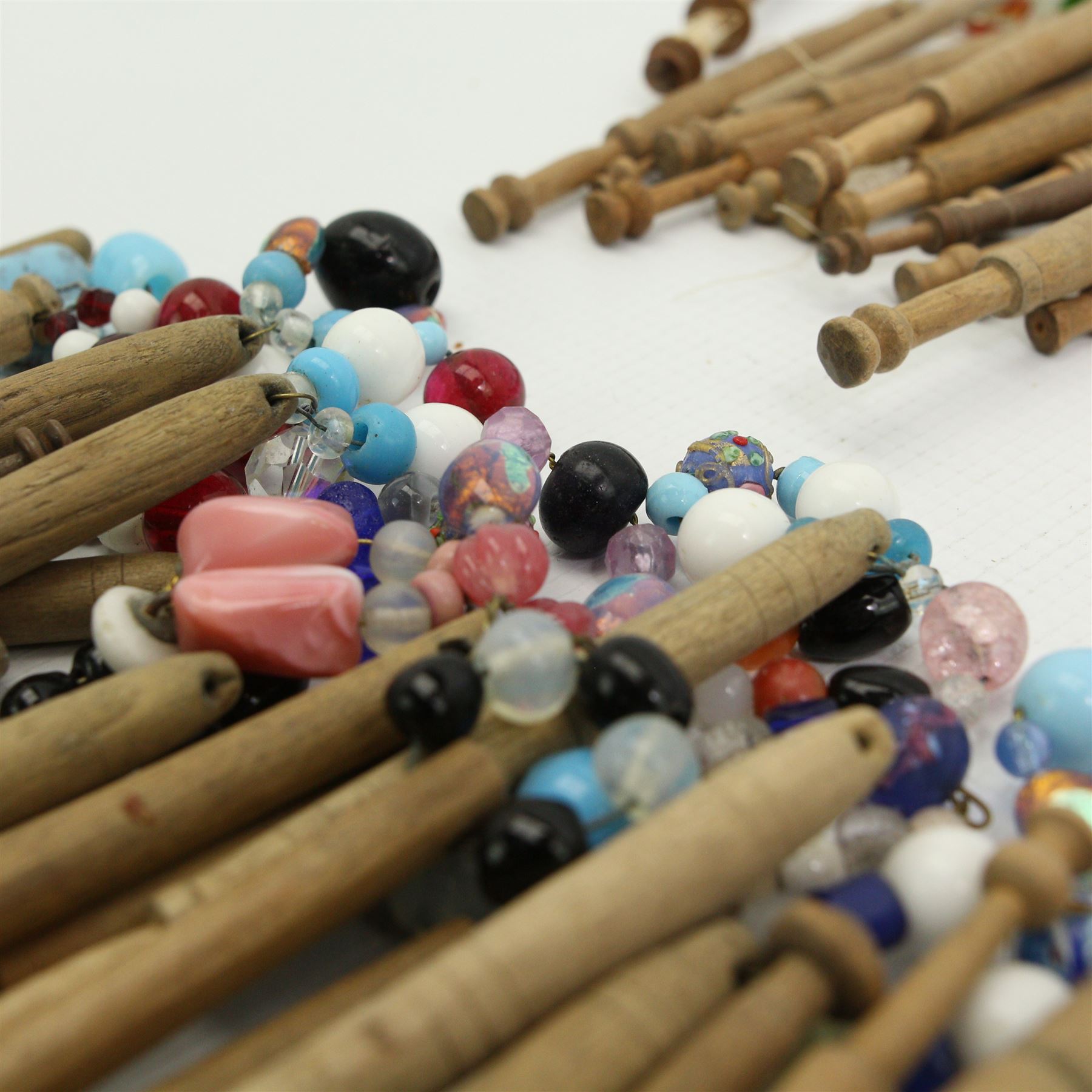 Collection of turned wooden lace maker's bobbins, including 19th century and later examples, mostly with glass spangles and turned shafts (80 approx)