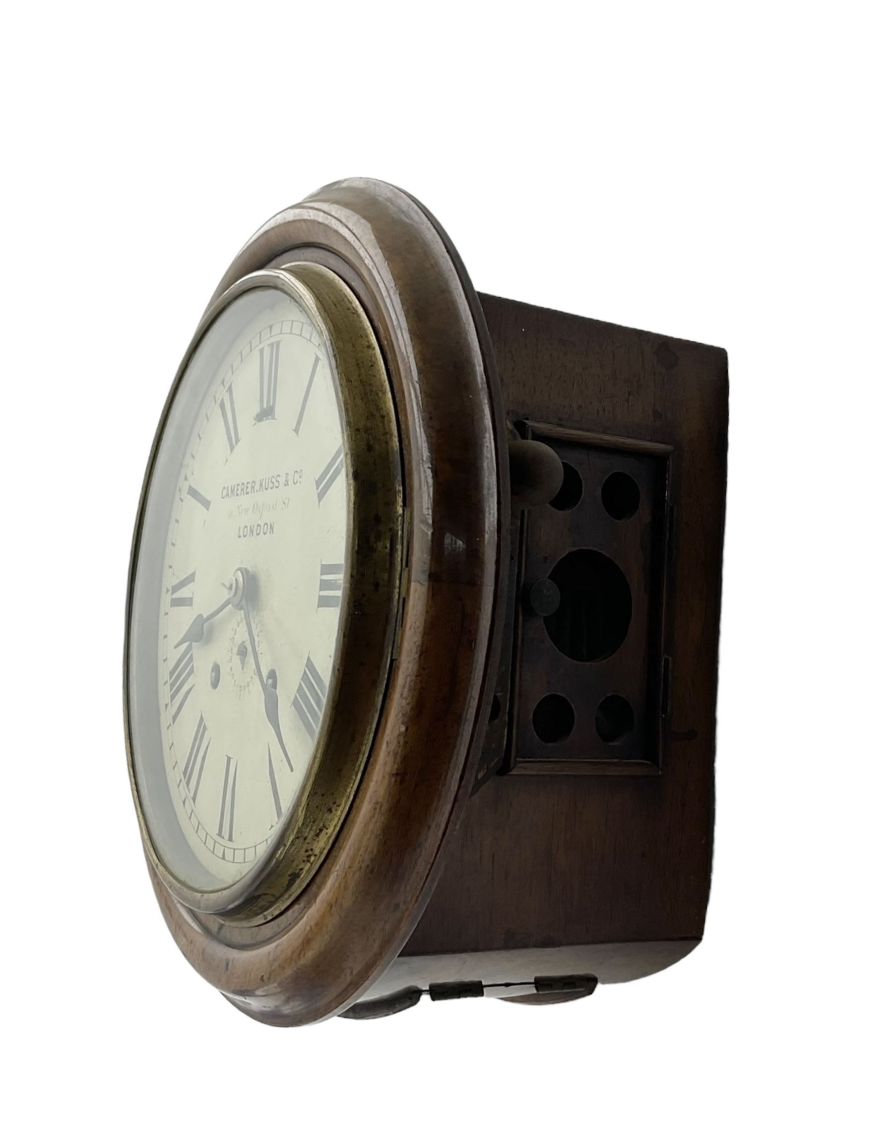 Camerer Kuss & Co -  8-day wall clock with alarm, mahogany dial surround and brass bezel, 8