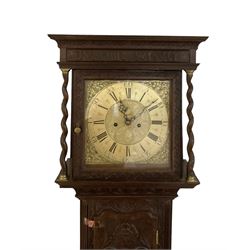 8-day - profusely carved oak longcase, with a flat top and square hood door beneath, door flanked by barley twist columns with brass capitals, trunk with reeded quarter columns and wavy topped door, on a carved plinth raised on bracket feet, brass dial with an engraved and matted dial centre, penny moon and date aperture, chapter ring inscribed “John Stancliffe” with Roman numerals and five-minute Arabic's, rack striking movement with a recoil anchor escapement. With pendulum and weights.