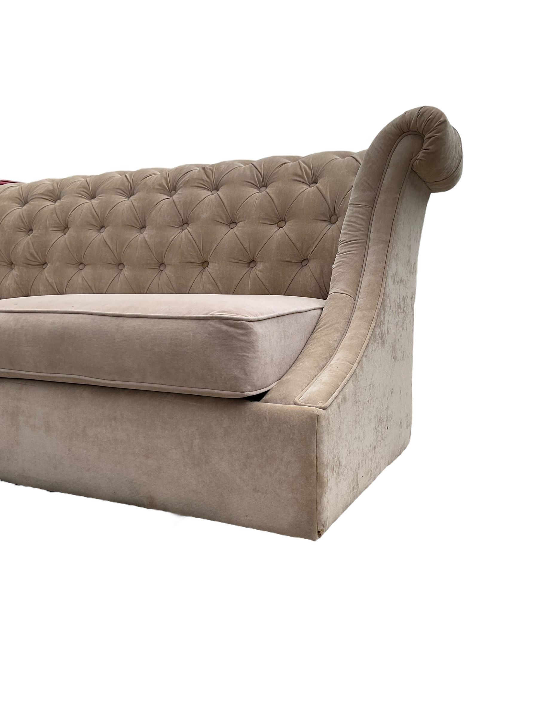 Grande wing back sofa bed, upholstered in beige buttoned fabric, metal action pull out double bed