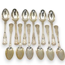 A matched set of 19th century silver Kings pattern cutlery comprising six table spoons, ten table forks, twelve dessert spoons, fish slice, pair of sauce ladles, ten teaspoons, six fish knives, seven silver handled knives, two salt spoons  and fifteen dessert forks, various dates and makers 