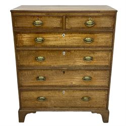 George III oak and mahogany banded chest, rectangular reed moulded top, fitted with two short and four long graduating cock-beaded drawers, mahogany banded drawer fronts with shied shaped escutcheons, on bracket feet 