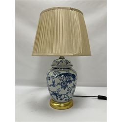 Table lamp of baluster form, decorated with exotic birds up fruiting trees, on gilt chrome pedestal, including shade H554cm