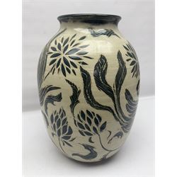 John Egerton (c1945-): studio pottery stoneware vase decorated with birds in flowers braches upon a white ground, H40cm