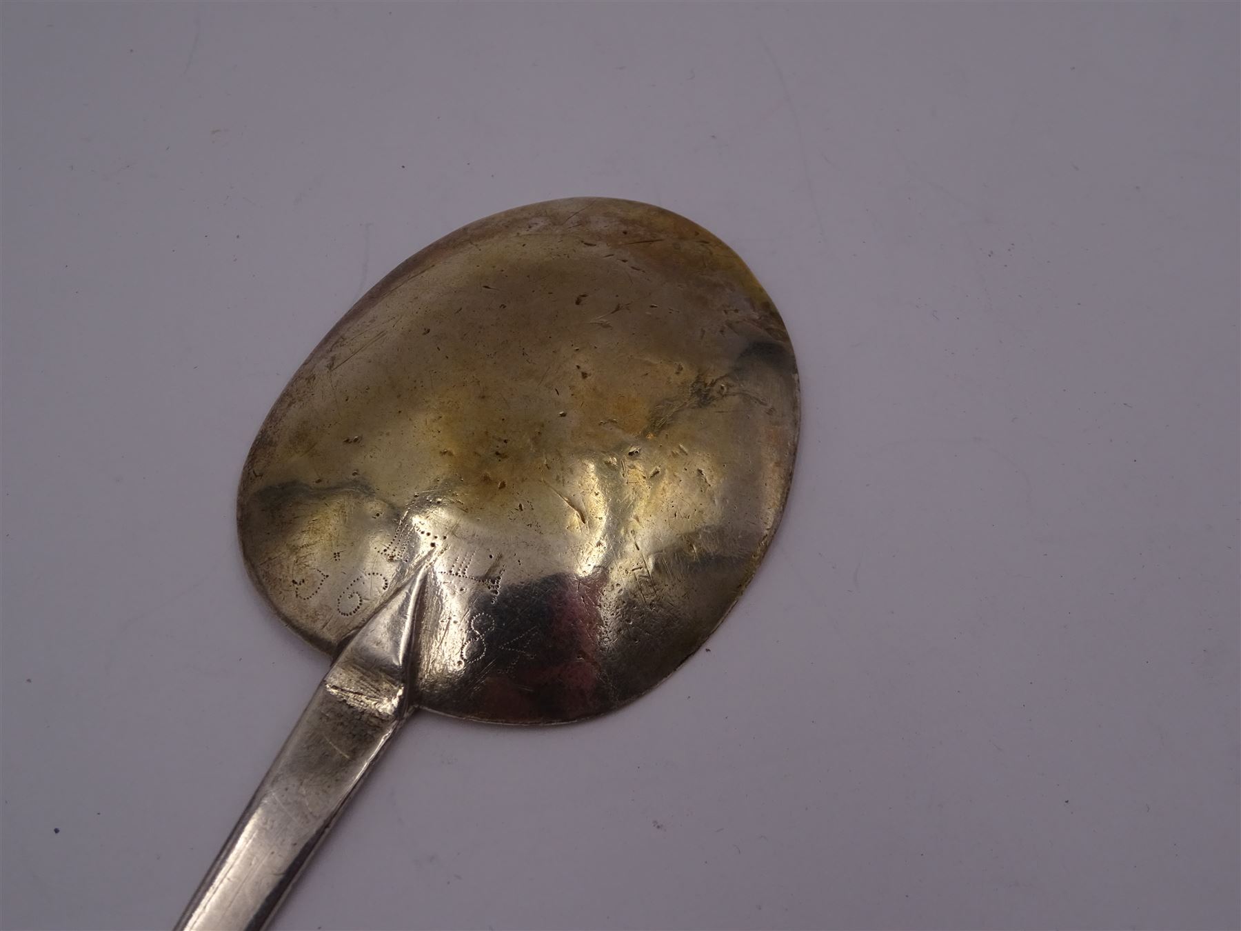 17th century silver trifid spoon, marks worn and indistinct, together with an Old English pattern silver spoon