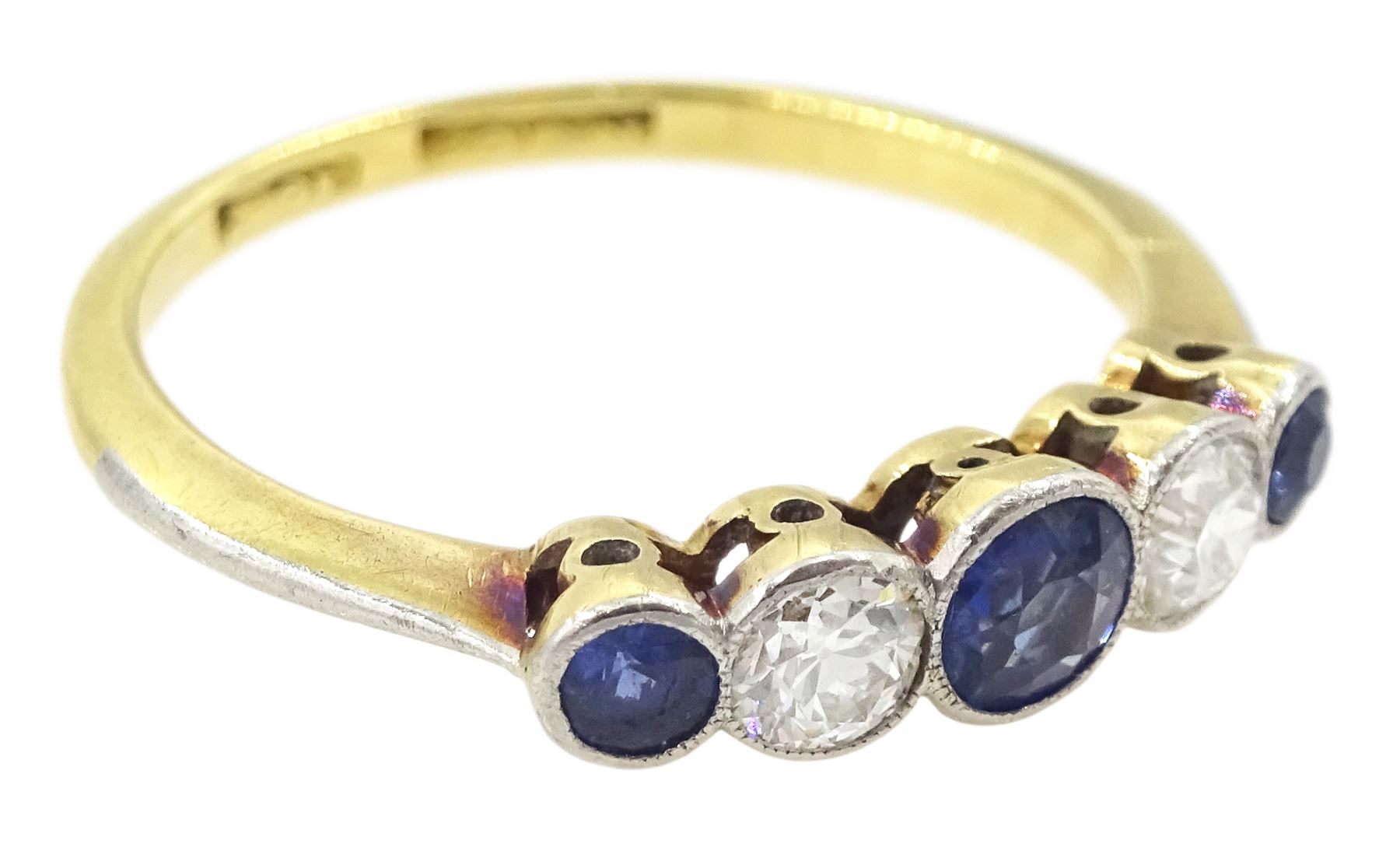 Early 20th century 18ct gold milgrain set five stone round cut sapphire and old cut diamond ring, stamped 18ct, total diamond weight approx 0.20 carat