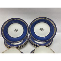 Wedgwood part tea and coffee service, comprising coffee pot, six coffee cans with five saucers, seven teacups with ten saucers and seven side plates, each decorated with floral bouquet to centre, in a gilt and speckled blue border, pattern x9933, with printed mark beneath