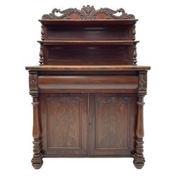 Victorian mahogany chiffonier, raised shaped pediment carved with scrolled extending foliage, two graduating shelves on turned supports, rectangular top over drawer and double cupboard, turned column pilasters, on turned feet 