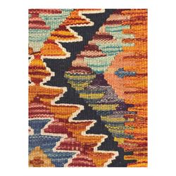 Chobi Kilim multicoloured ground runner, displaying diamond-shaped motifs in shades of blue, red, yellow, and green, accented by a bold black outline and bordered with a striped design, flatwoven with fringed edges