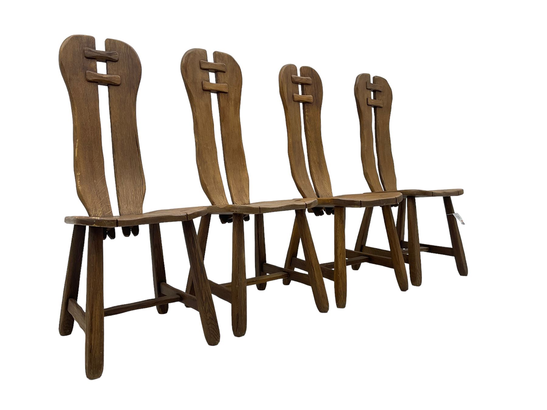 Attributed to De Puydt - set of four mid-century Brutalist oak dining chairs, twin slat back united by pegs, on square tapering supports united by H-stretcher 