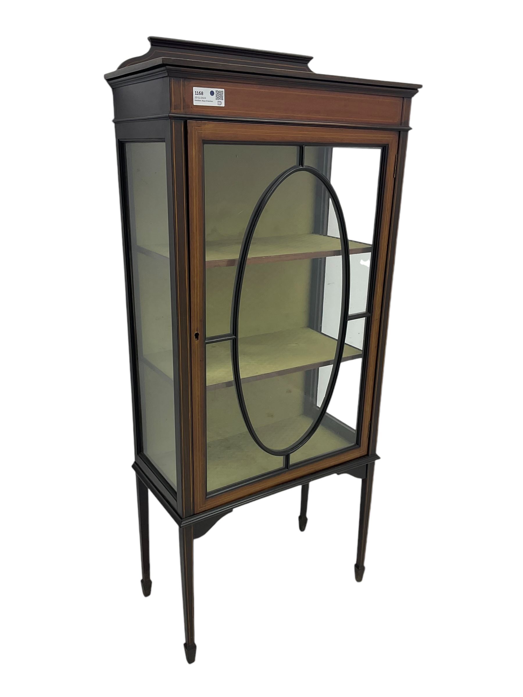 Edwardian inlaid mahogany display cabinet, shaped and raised back over single astragal glazed door, interior lined and fitted with two shelves, raised on square tapering supports