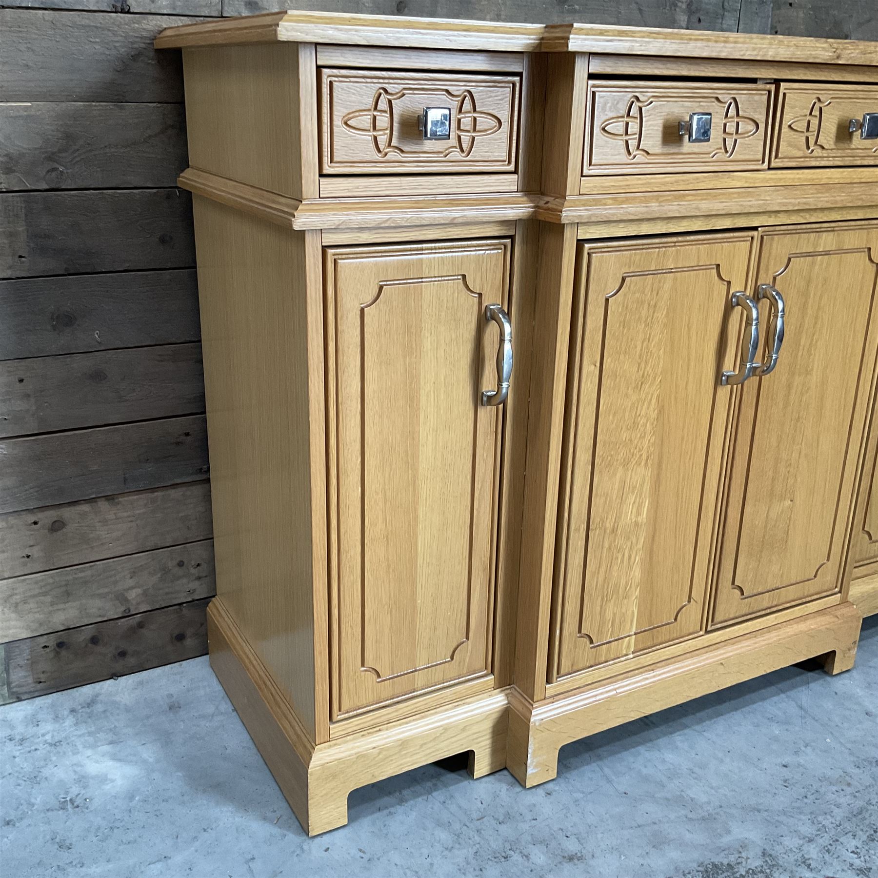 Light oak breakfront sideboard dresser, fitted with four drawers and four cupboards